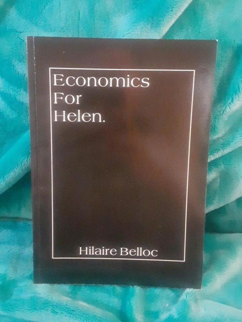 Economics For Helen by Hilaire Belloc. paperback, some cover wear, good shape.